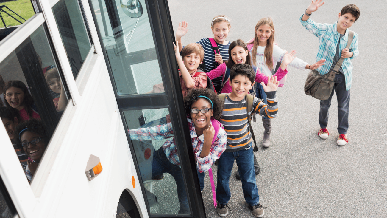 Children getting on coach